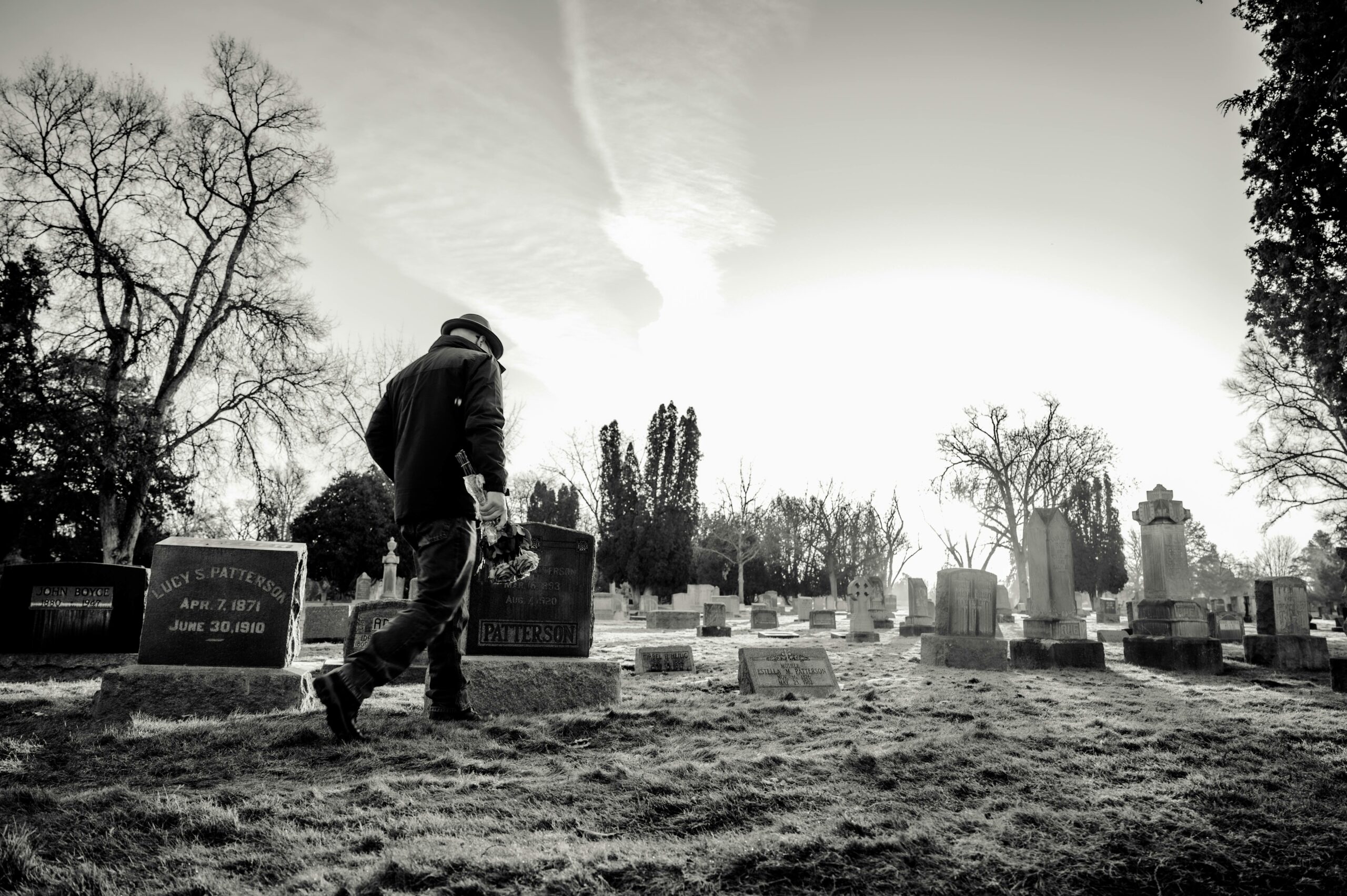 black and white photo of man in gravesite